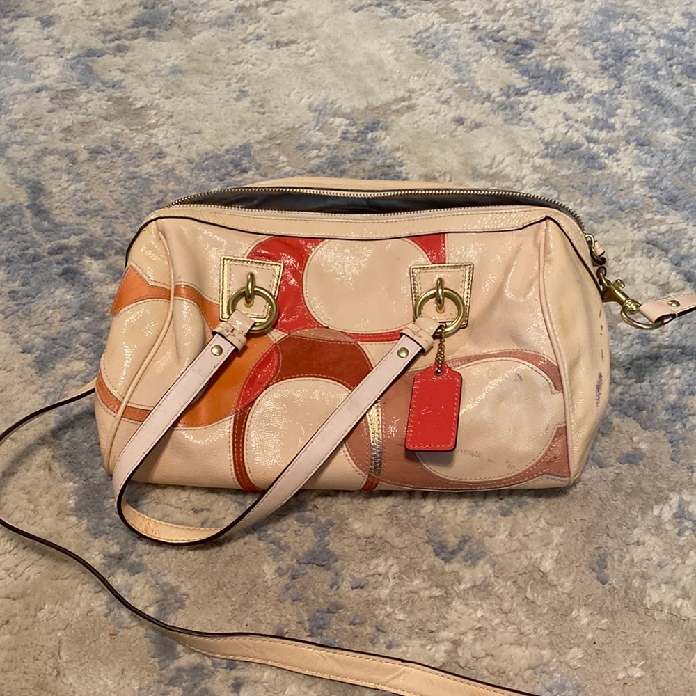 Pink leather Coach handbag with shoulder strap